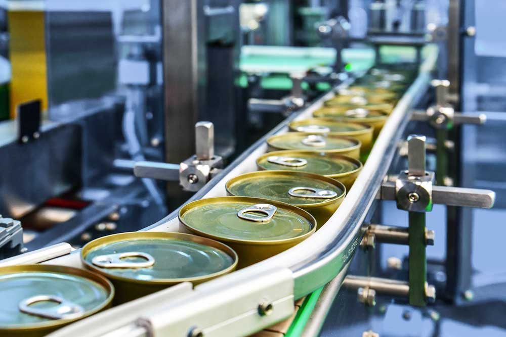 Pet food cans on the assembly line